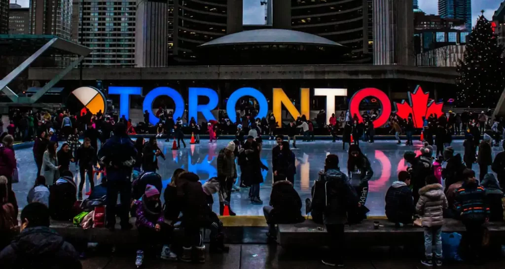 People Gathered in Front of Toronto Freestanding Signage