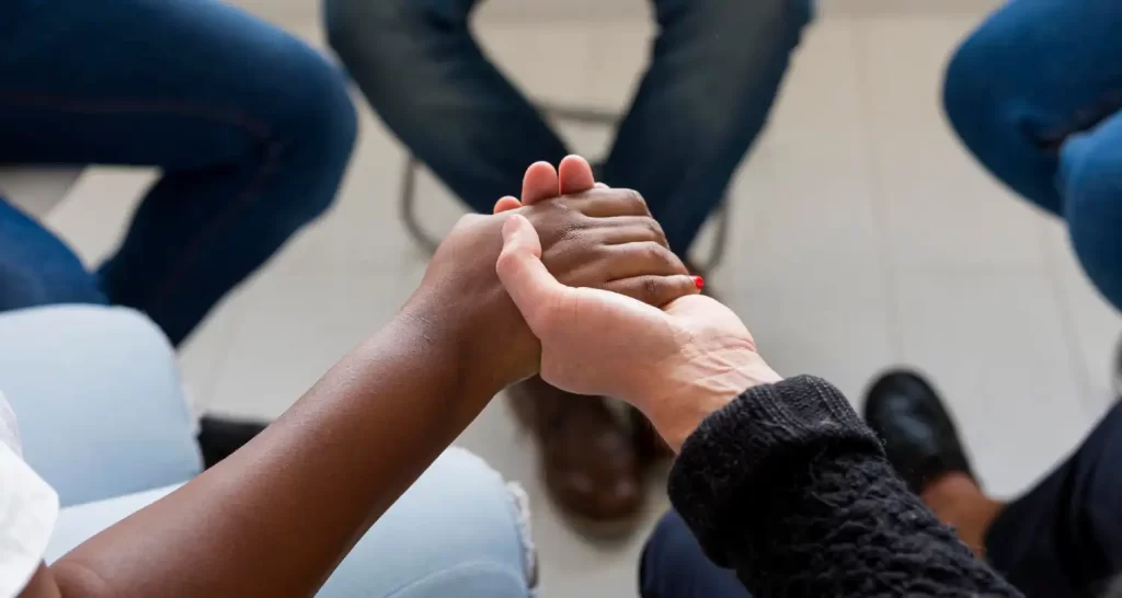 Close-up people holding hands