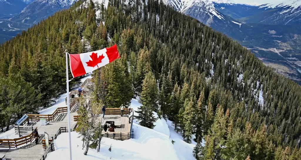 Flag of Canada on Hilltop at Banff National Park