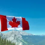 Candian flag on mountains