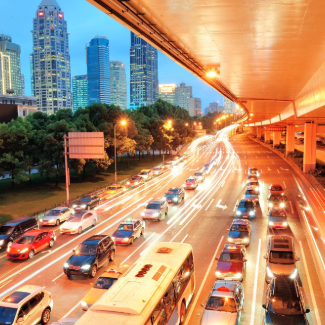 Shanghai street view with urban scene and busy traffic at dusk