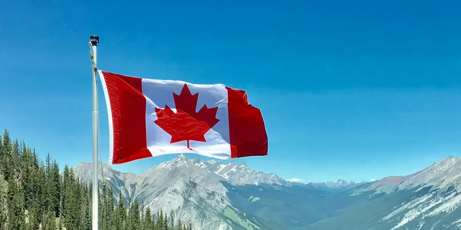 Candian flag on mountains