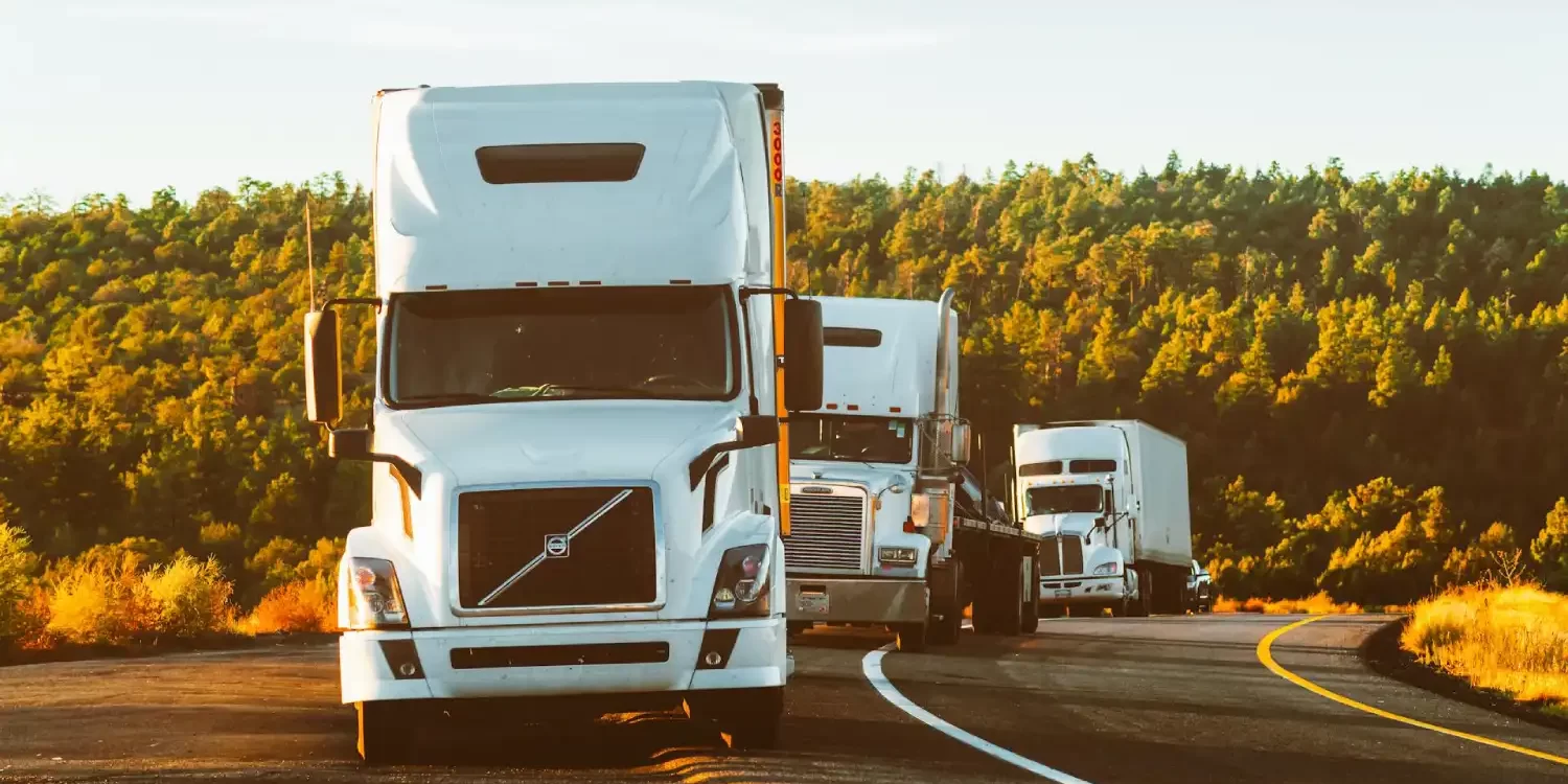 White Volvo Semi-truck on Side of Road